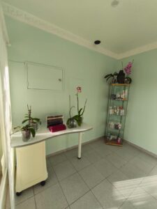 Salon room with a table, plants, and product display